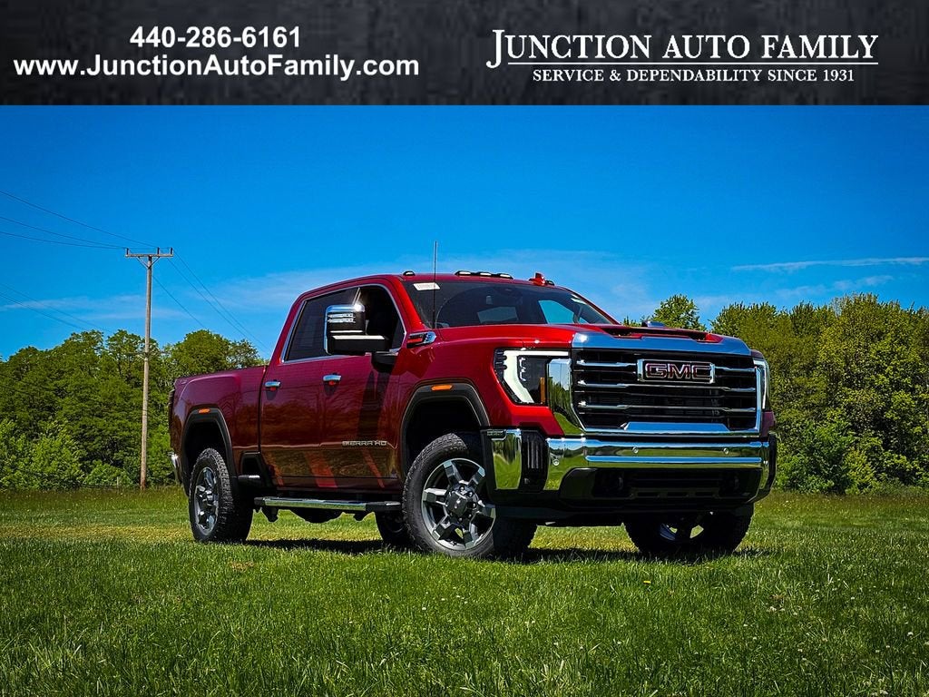 2026 GMC Sierra 2500 HD SLT in Volcanic Red Tintcoat — front three-quarter view