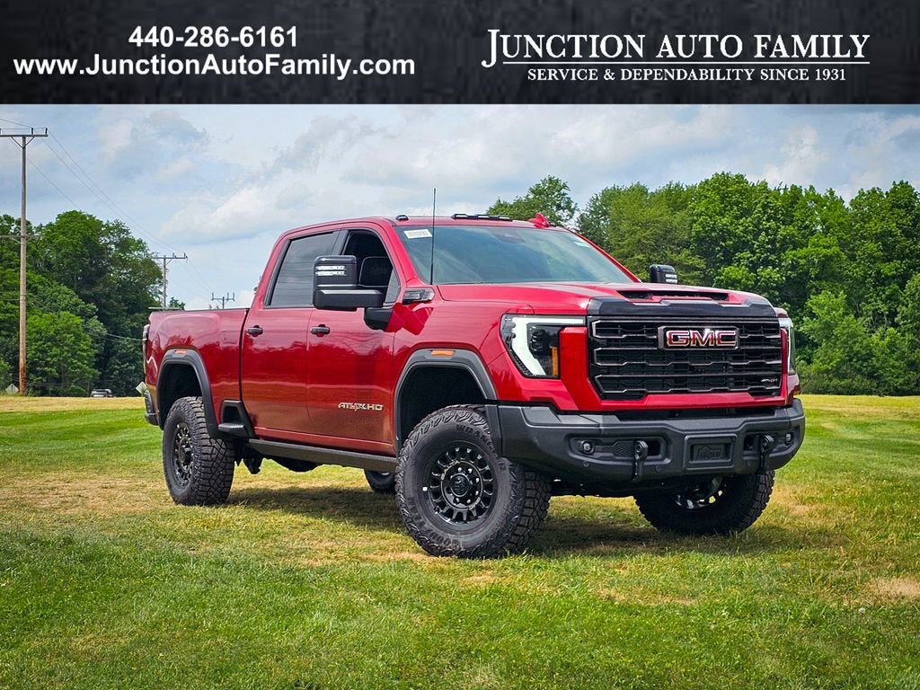 2026 GMC Sierra 2500 HD AT4X in Volcanic Red Tintcoat — front three-quarter view