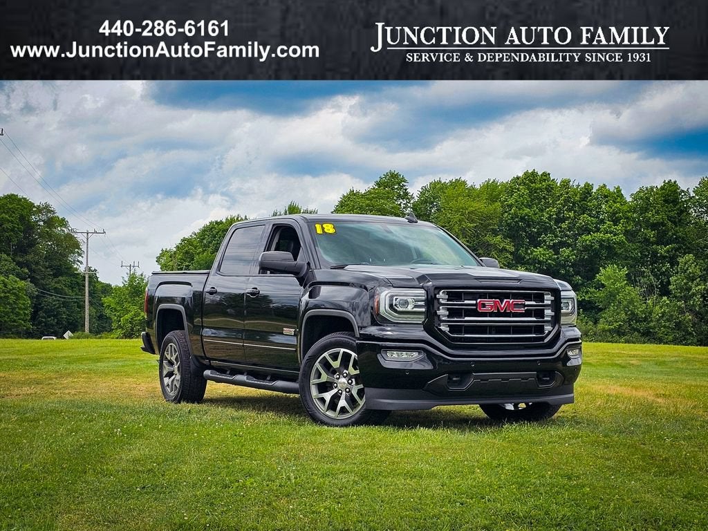 2018 GMC Sierra 1500 SLT in Onyx Black — front three-quarter view