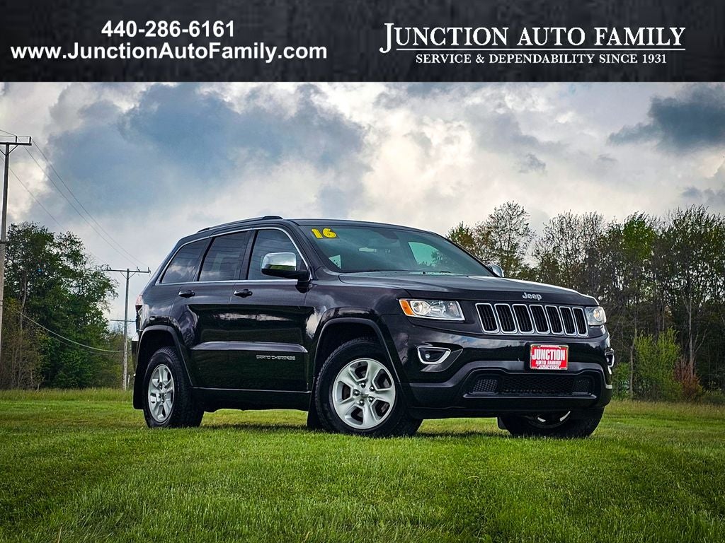 2016 Jeep Grand Cherokee Laredo in Brilliant Black Crystal Pearlcoat — front three-quarter view