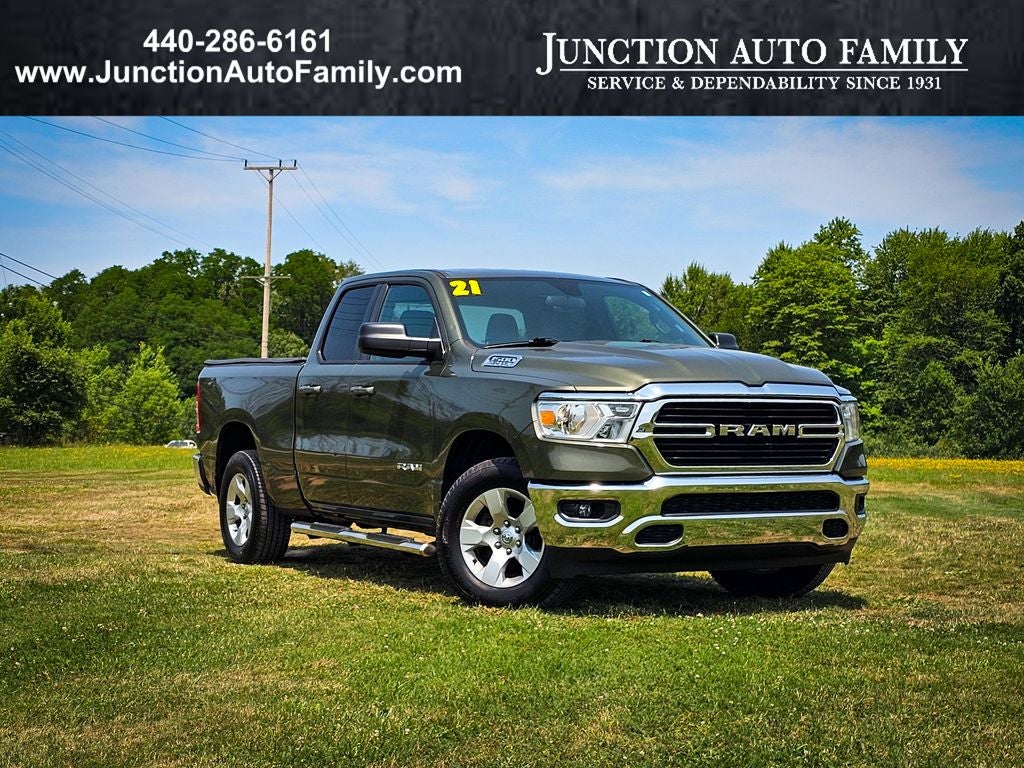 2021 RAM 1500 Big Horn Quad Cab 4x4 6'4' Box in Olive Green Pearlcoat — front three-quarter view