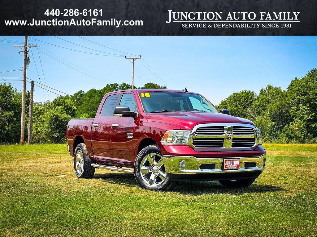 2018 RAM 1500 Big Horn Crew Cab 4x4 5'7' Box in Delmonico Red Pearlcoat — front three-quarter view