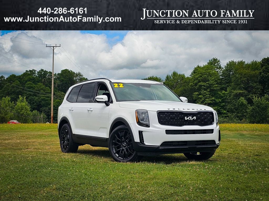 2022 Kia Telluride EX in Glacial White Pearl — front three-quarter view